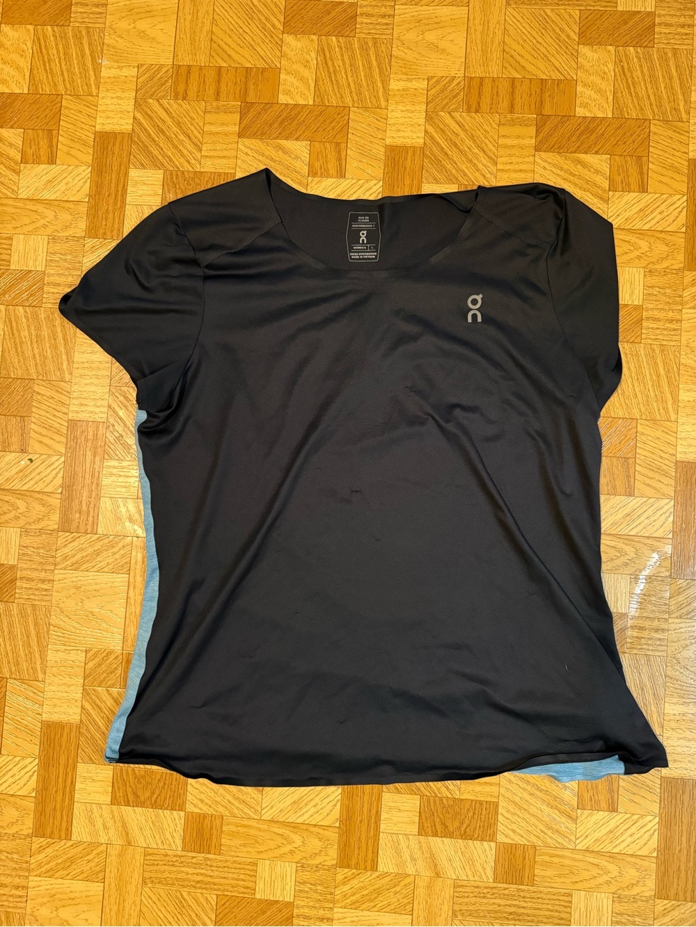 On Running Women's Black and Blue Short Sleeve Performance Tee